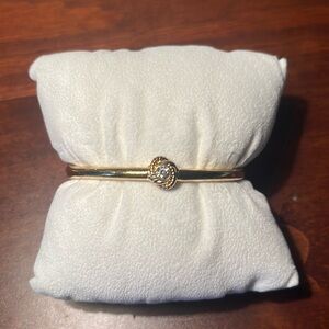 Kate Spade gold hinged bangle with crystal knot